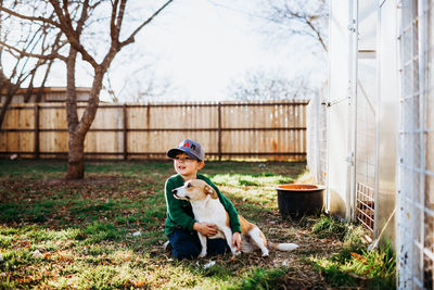 Dog sitting on field