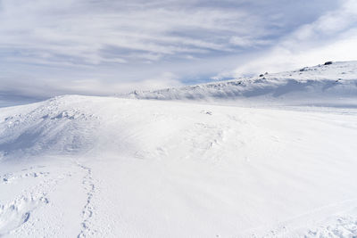 Scenic view of snow covered mountain against sky