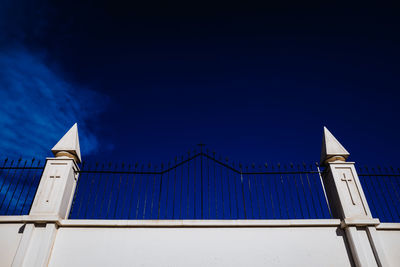 Low angle view of building against clear blue sky