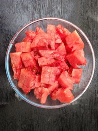 High angle view of chopped fruits in bowl on table