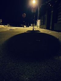 Street lights on road in city at night