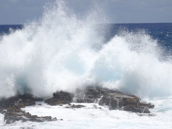 Waves splashing on rocks