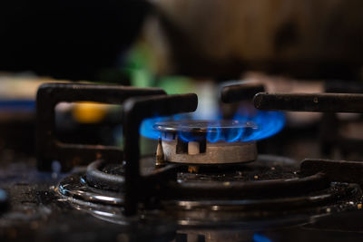 Closeup shot of blue fire from domestic kitchen stove top. gas cooker with burning 