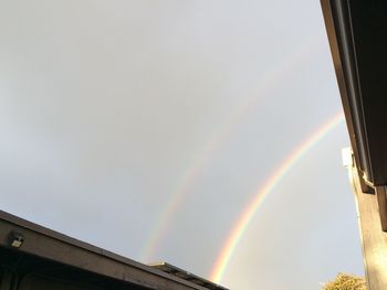 Low angle view of rainbow against sky
