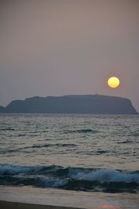 Scenic view of sea against clear sky during sunset