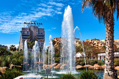 Fountain in park against sky