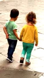 Rear view of couple walking