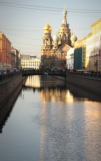 View of river in city at sunset