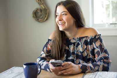 Young woman using mobile phone