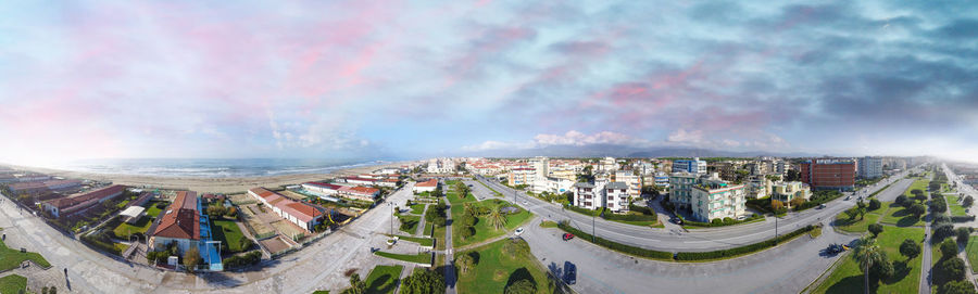 High angle view of buildings in city against sky