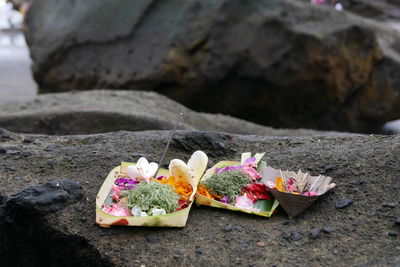 Close-up of religious offerings on rock