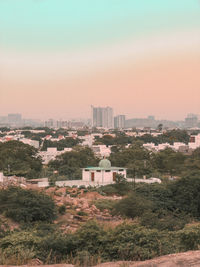High angle view of buildings in city against clear sky