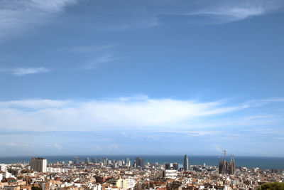High angle view of buildings in city against sky