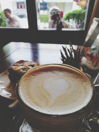 Close-up of cappuccino on table