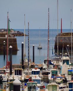 Boats moored at harbor