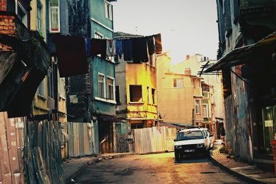 Street amidst buildings against clear sky