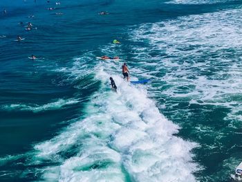 High angle view of man surfing in sea