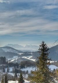 Scenic view of mountains against sky during winter