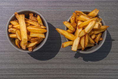 High angle view of meat and fries on table