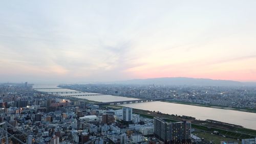 High angle view of city against sky during sunset