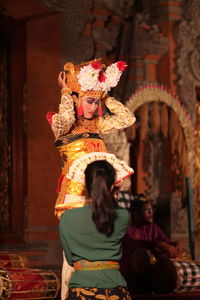 Woman wearing traditional dress during performance