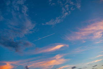 Low angle view of vapor trails in sky