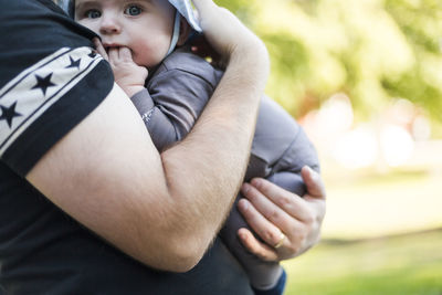 Father carry baby