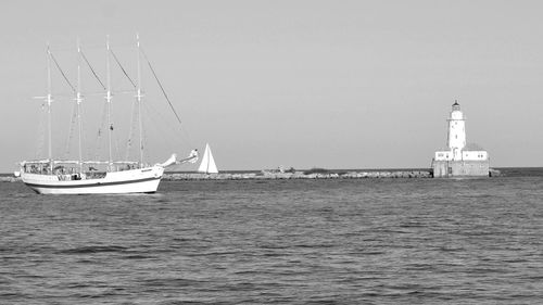 Ship in sea against clear sky