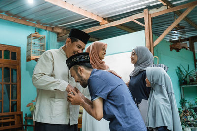 Family greeting each other during festival at home