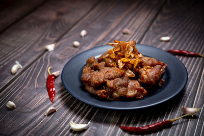 High angle view of meat in plate on table