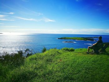 Scenic view of sea against blue sky