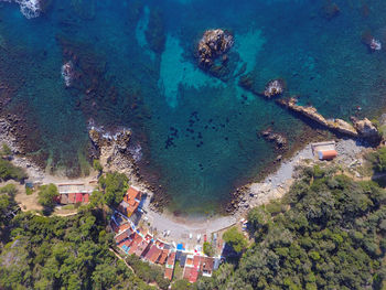 High angle view of buildings by sea