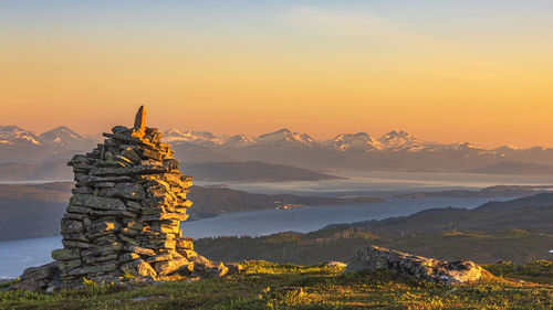 Scenic view of mountain against sky during sunset