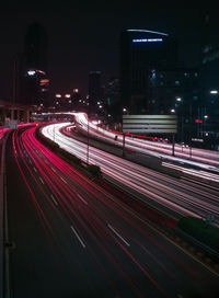 High angle view of light trails on road at night