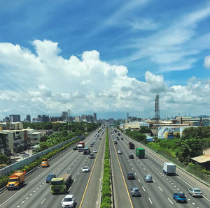High angle view of vehicles on road against sky
