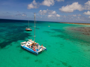 Sailboat in sea against sky