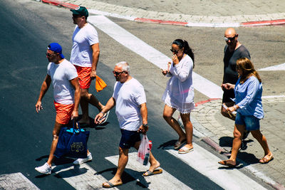 High angle view of people walking on street