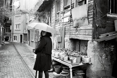 A woman with umbrella on rainy day