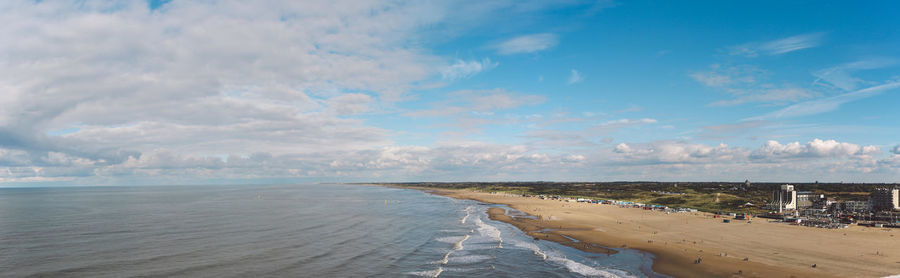 View of beach against cloudy sky