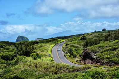 Road passing through field