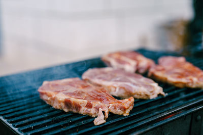 Close-up of meat on barbecue grill