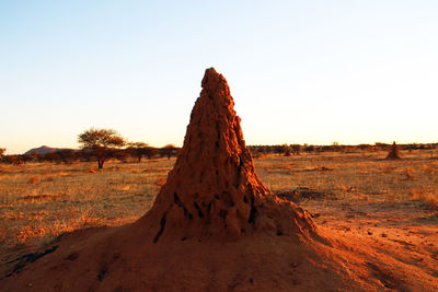 View of rock formation on land against clear sky