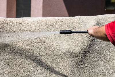 Close-up of hand holding umbrella