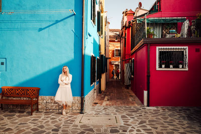 Rear view of woman walking on street