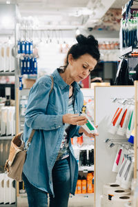 Senior woman shopping in hardware store