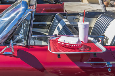 Close-up of red antique convertible car