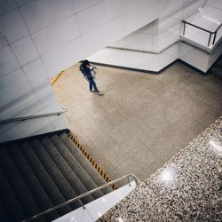 High angle view of woman on tiled floor