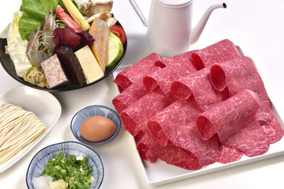 High angle view of fruits in plate on table