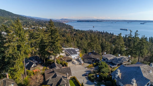 High angle view of trees by sea against sky
