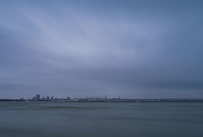 Scenic view of sea against blue sky